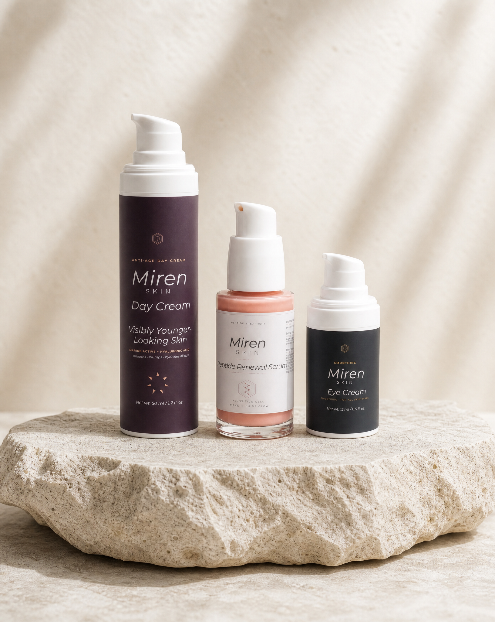MirenSkin Peptide Longevity Set: HexaPeptide-11 Serum, Anti-Age Day Cream, and De-Puffing Eye Cream on natural stone