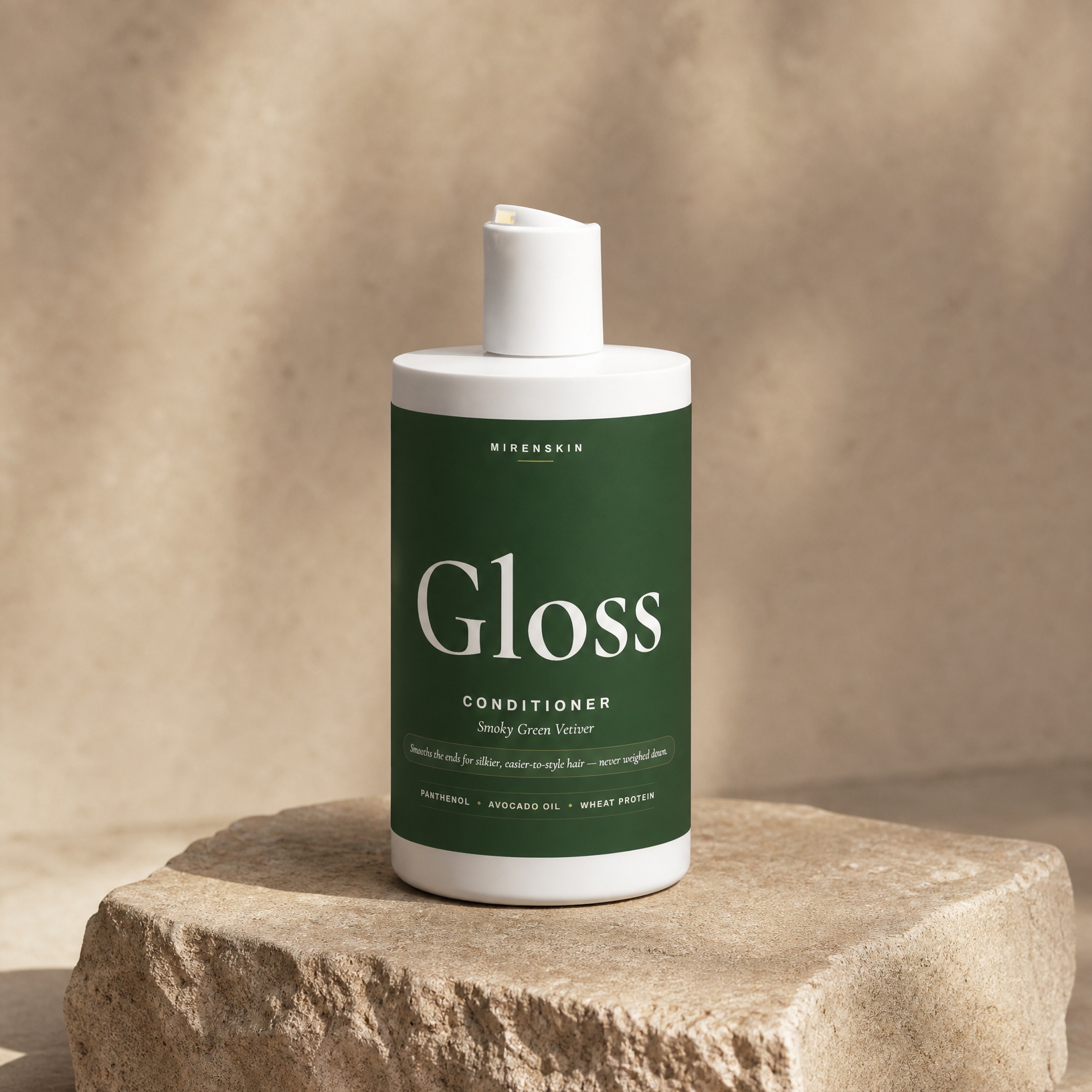 MirenSkin Gloss Conditioner in Smoky Green Vetiver on natural stone