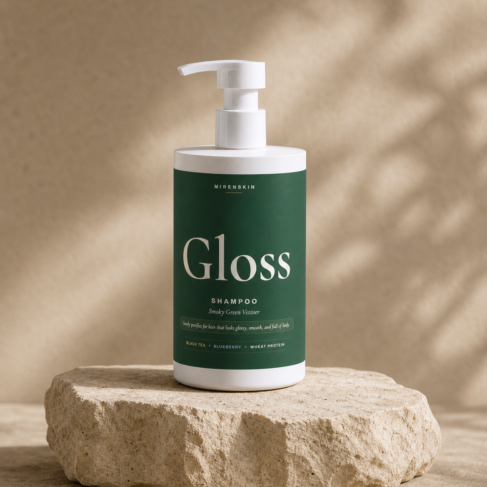 MirenSkin Gloss Shampoo in Smoky Green Vetiver on natural stone
